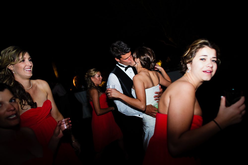 funny pic of bride and groom kissing at the reception