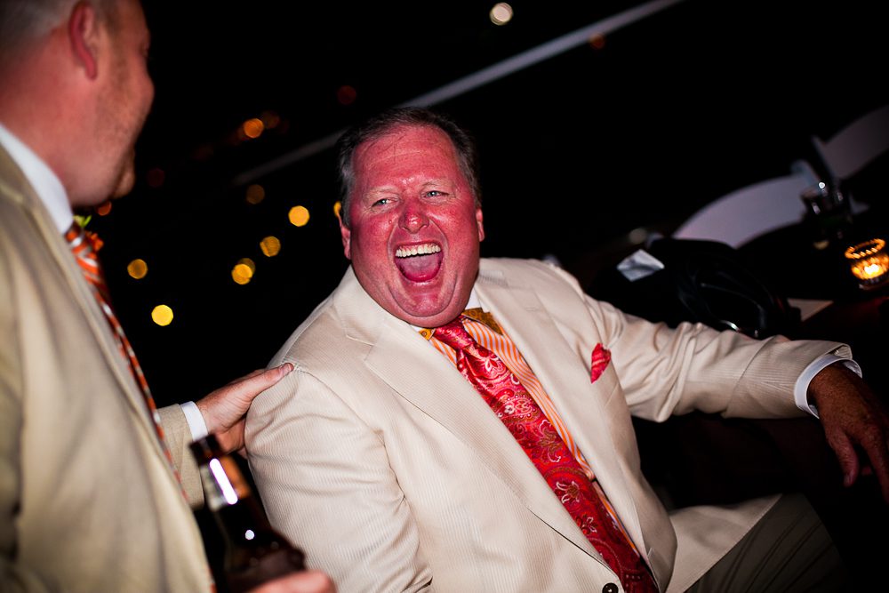 fat guy laughing at the wedding