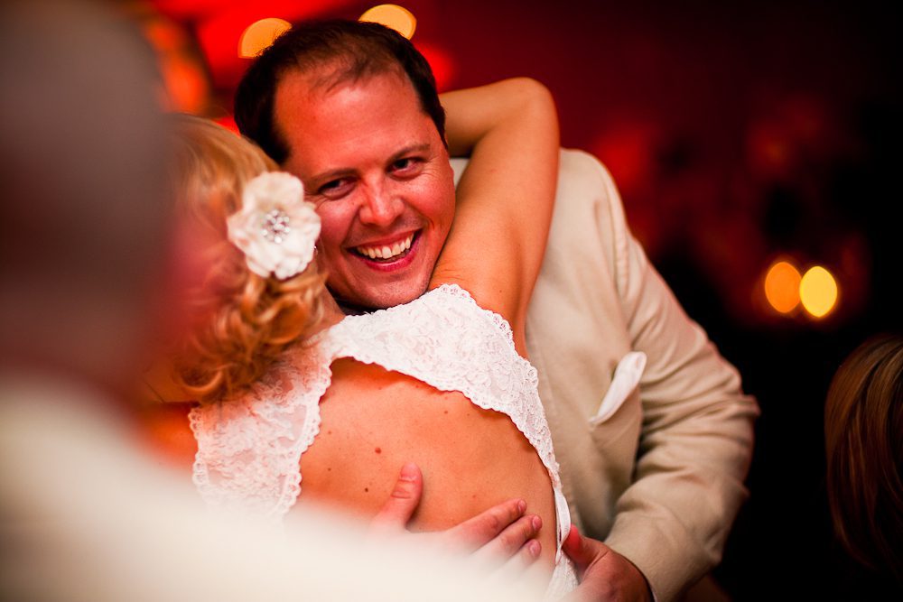the best man hugs the bride after speech