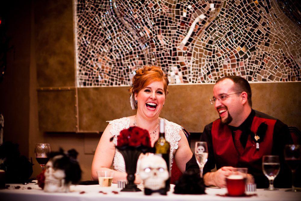 bride and groom laughing during the toast