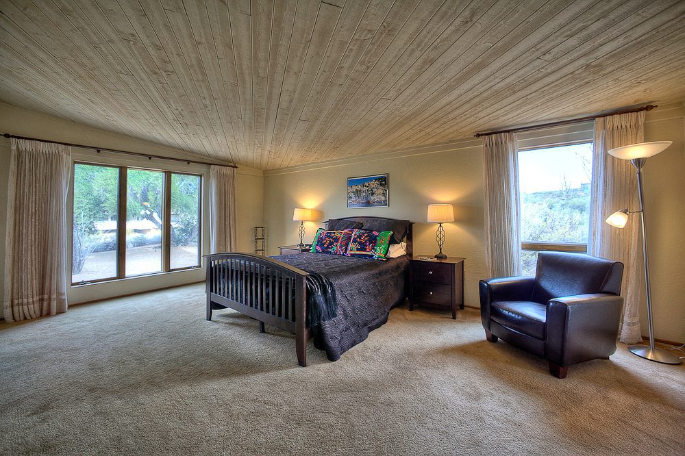 master bedroom with amazing wood ceiling