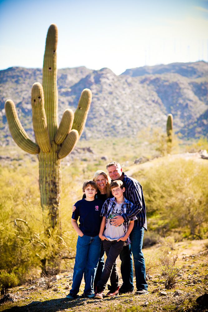 the family with cacti in the background