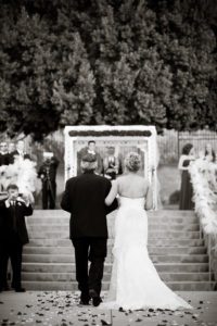 walking down the aisle to the ceremony