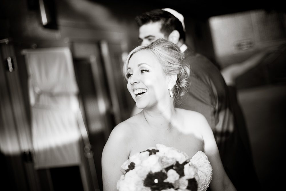 a candid of the bride laughing after the ceremony