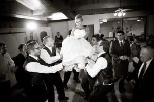bride being carried in a chair