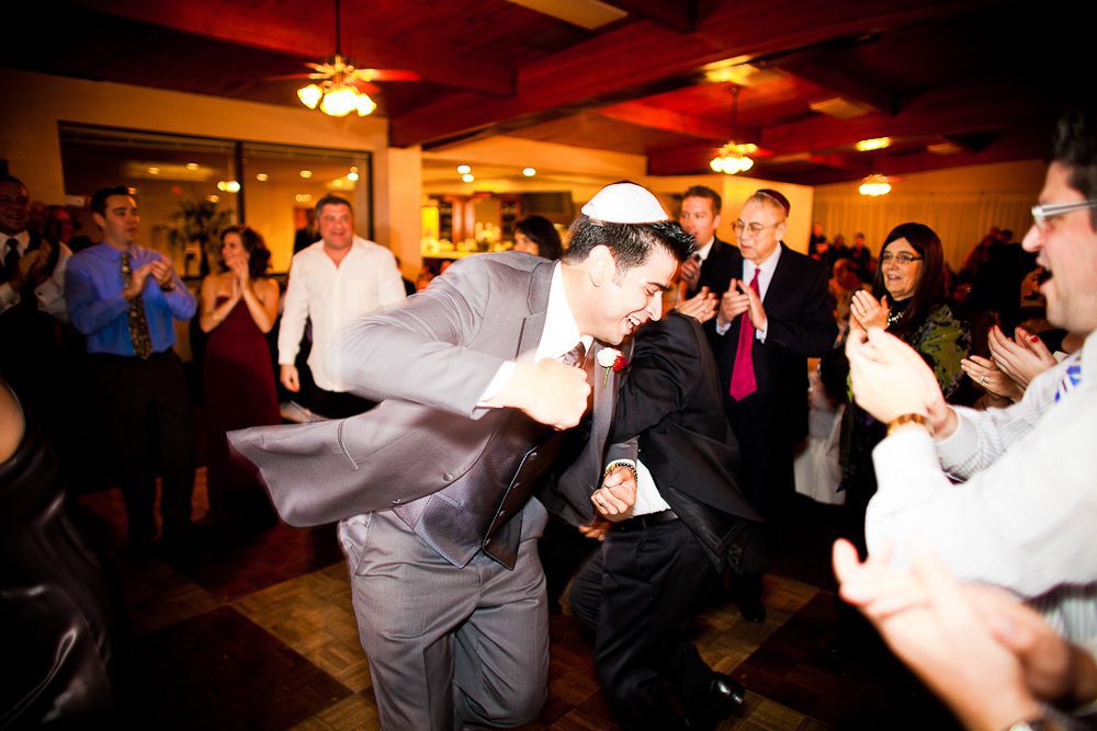 the groom dancing at the reception