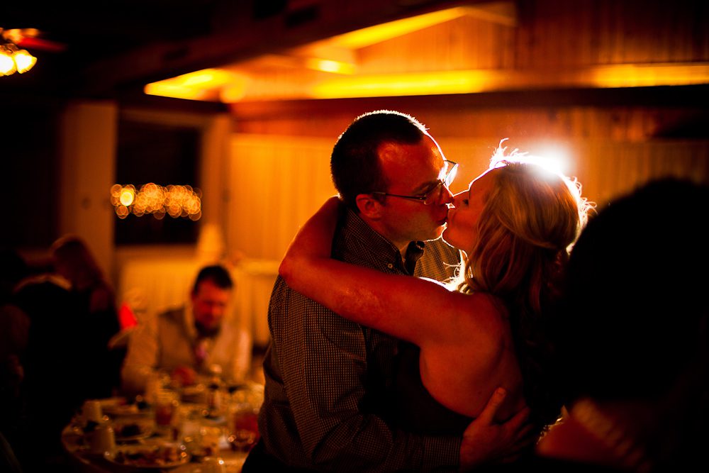 a couple kisses during the reception