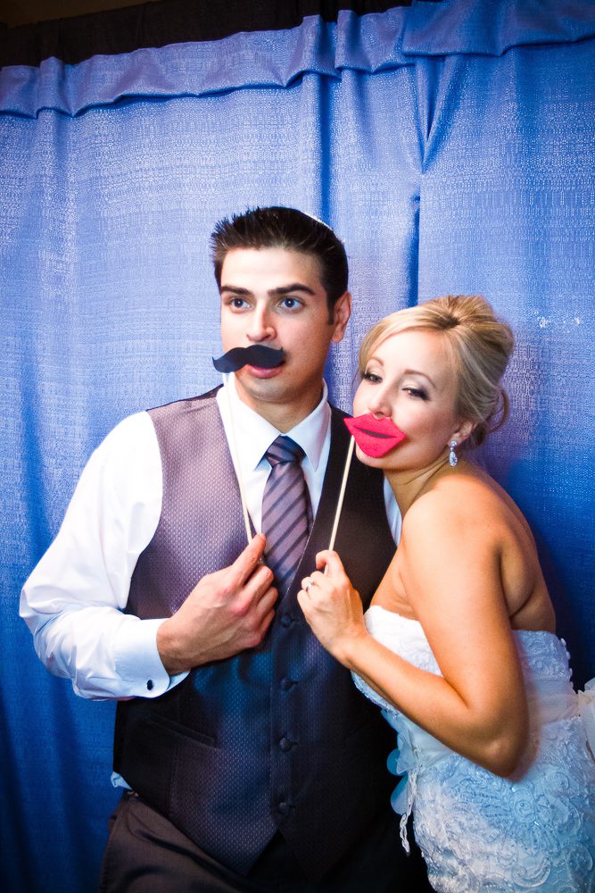 bride and groom in the photo booth
