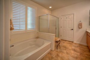 master bath with separate shower and tub