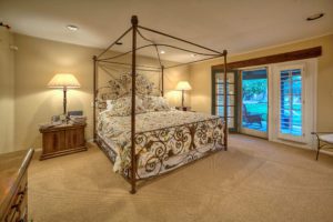 master bedroom with view to backyard