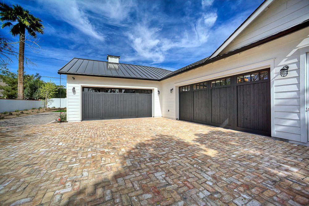 garage with stone driveway