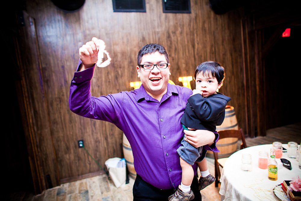 dad and little boy caught the garter