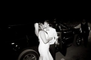 kissing before leaving the wedding